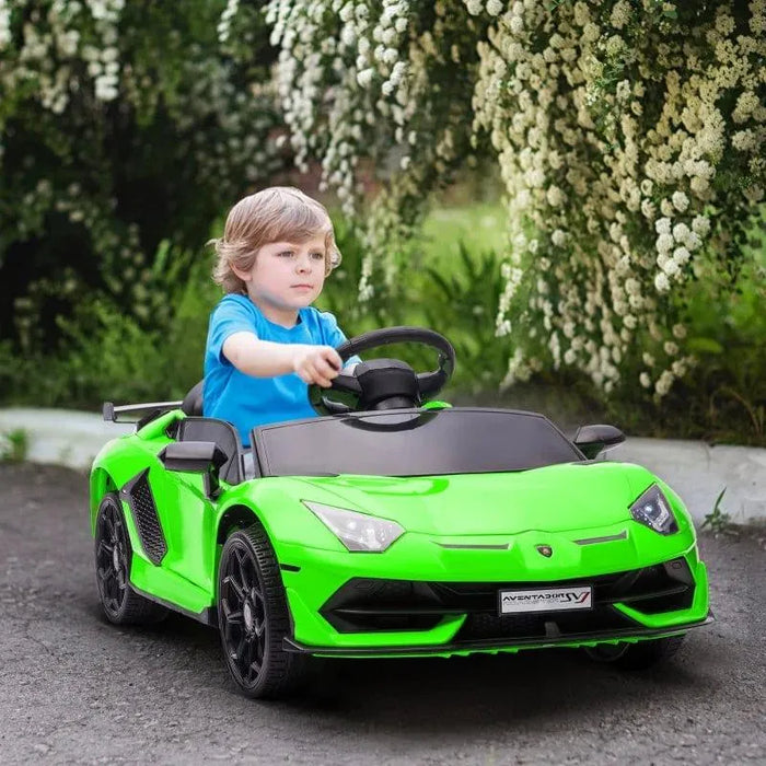 Child driving green 12V Lamborghini Aventador kids ride-on car outdoors