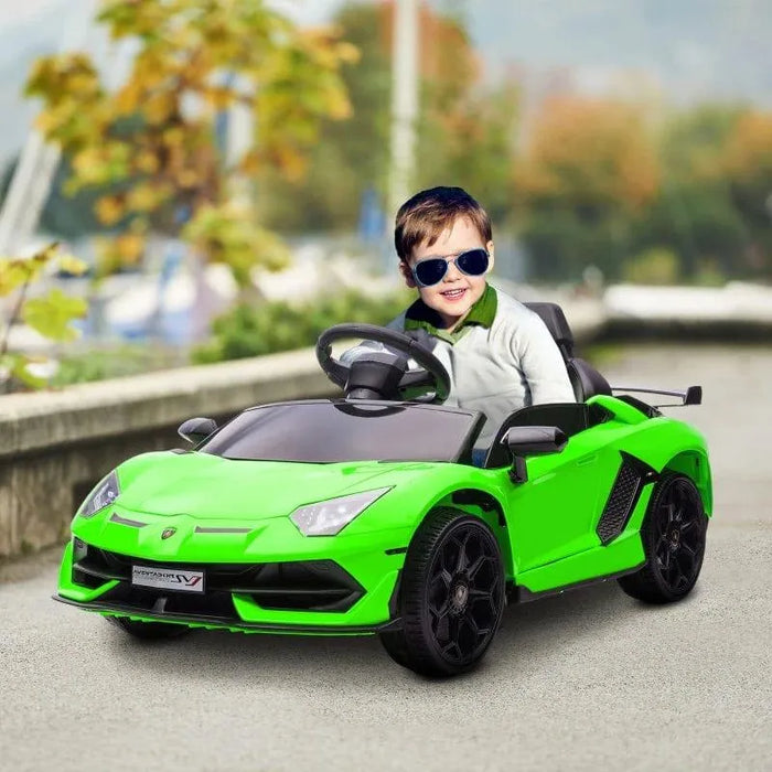 Smiling child in green 12V Lamborghini Aventador kids ride-on car with butterfly doors