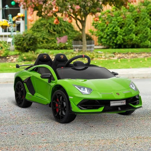 Green 12V Lamborghini Aventador SVJ kids ride-on car with lights, parked outdoors