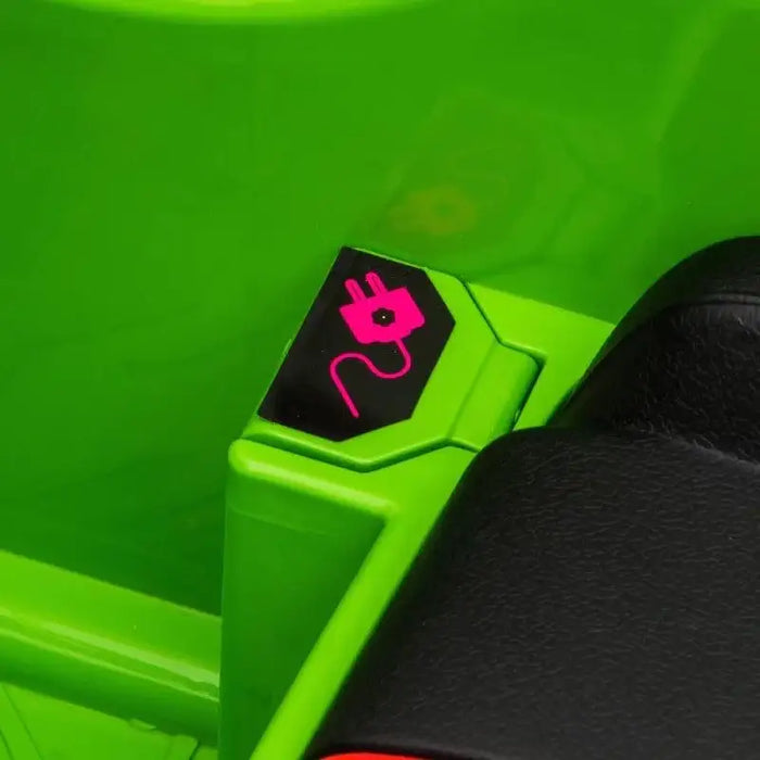 Close-up of green 12V Lamborghini kids ride-on car charging port symbol