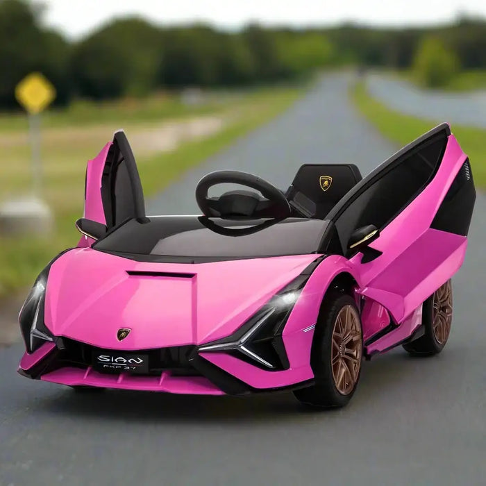 Pink 12V Lamborghini Sian kids ride-on car with open doors on a road