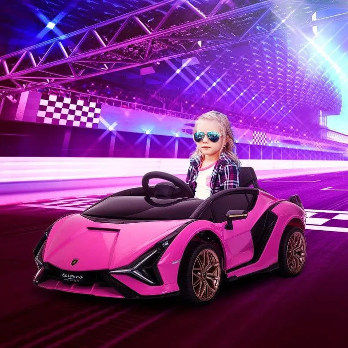 Child driving pink 12V Lamborghini Sian kids ride on car at racetrack, wearing sunglasses