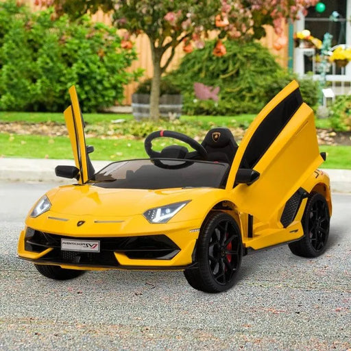 Yellow kids 12V Lamborghini SVJ electric ride-on car with LED lights and open scissor doors outdoors