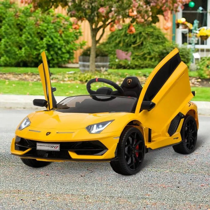 Yellow kids 12V Lamborghini SVJ electric ride-on car with LED lights and open scissor doors outdoors