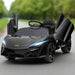 Black 12V McLaren kids electric ride-on car with butterfly doors and lights open on road