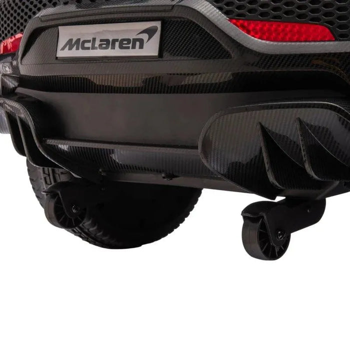 Rear close-up of black McLaren 12V kids electric ride-on car with license plate and wheels