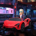 Little girl in sunglasses driving red 12V licensed McLaren kids ride-on car, city background