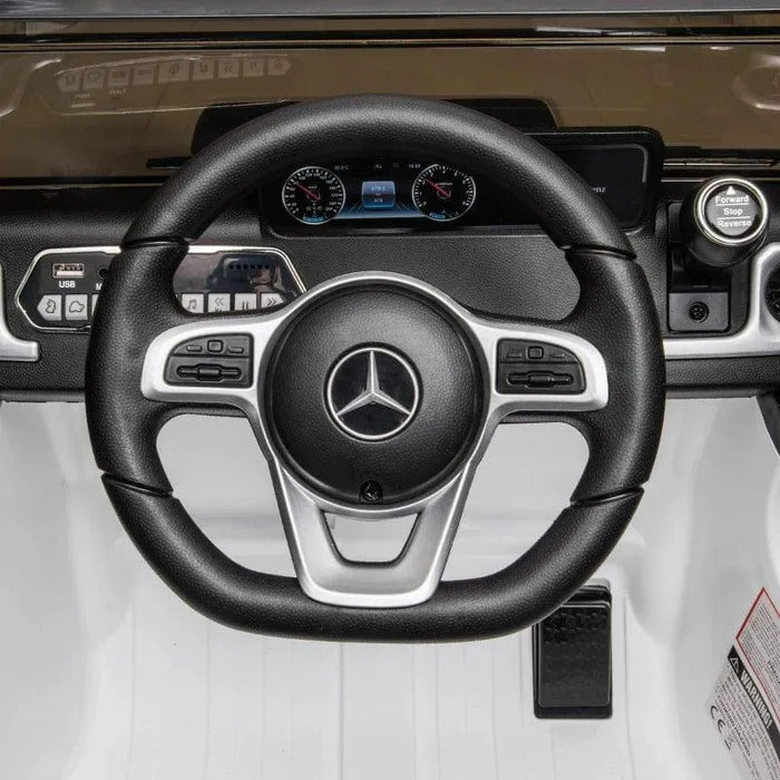 Kids electric Mercedes-Benz G500 ride-on jeep dashboard and steering wheel, black and white