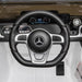 Kids electric Mercedes-Benz G500 ride-on jeep dashboard and steering wheel, black and white