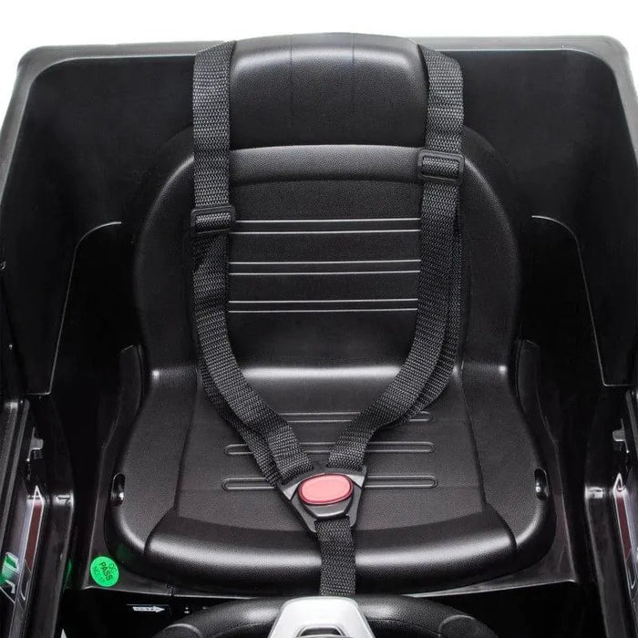 Black plastic seat with safety harness in a kids' Mercedes-Benz G500 ride-on jeep