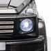Black Mercedes-Benz G500 kids ride on jeep close-up with bright headlight