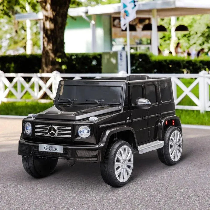 Black 12V Mercedes-Benz G500 kids ride on jeep toy car outdoors on pavement