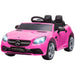 Pink Mercedes-Benz SLC 300 kids electric ride-on car with black seats and headlights on