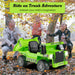 Bright green electric ride-on dump truck toy with open bed, kids playing with autumn leaves outdoors