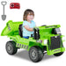 Child riding green electric toy dump truck with remote control and toy shovel
