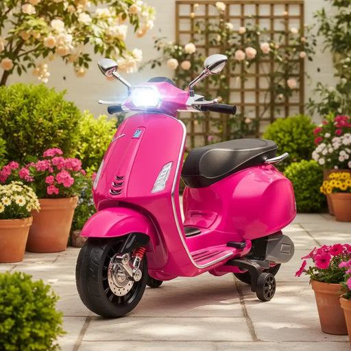 Bright pink scooter with black seat and mirrors, parked on patio surrounded by flowering plants