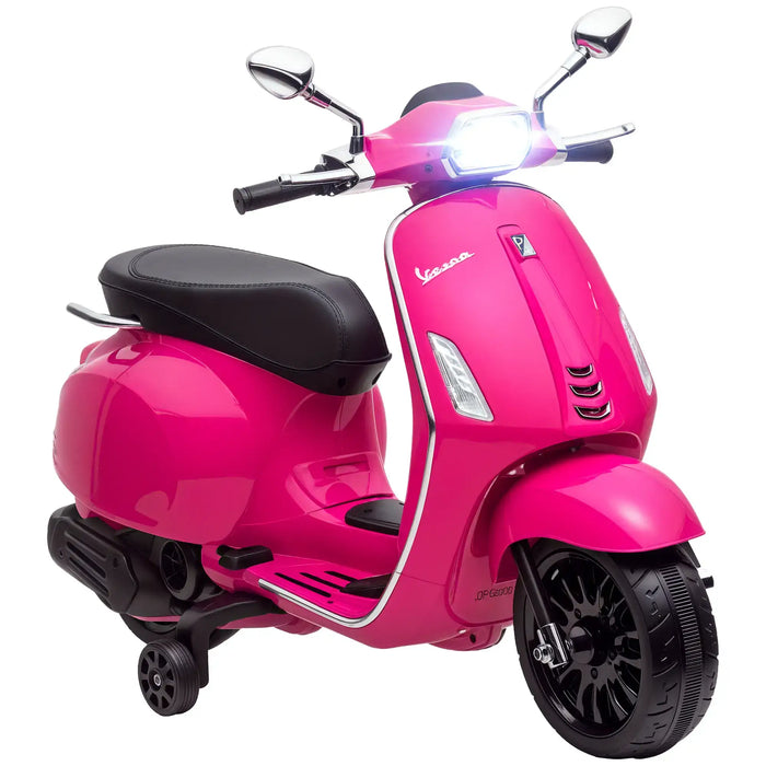 Bright pink Vespa scooter toy with black seat, training wheels, and front headlight on