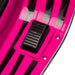 Close-up of black foot pedal on pink surface with black stripes and silver screws