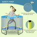 Child jumping on blue and yellow indoor kids trampoline with safety net and padding.