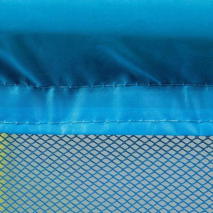 Close-up of blue trampoline safety net and padded edge, kids indoor trampoline design.