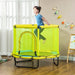 Child jumping on yellow indoor square bungee trampoline with safety net in playroom