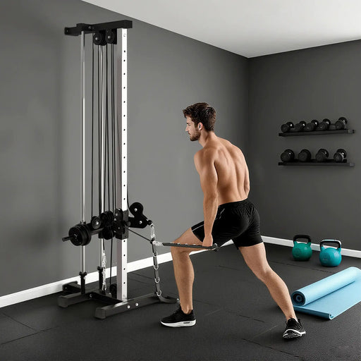 Man exercising with a cable machine in a home gym setting.