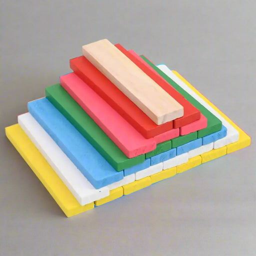 Stack of colorful rectangular wooden building blocks for kids on a gray background