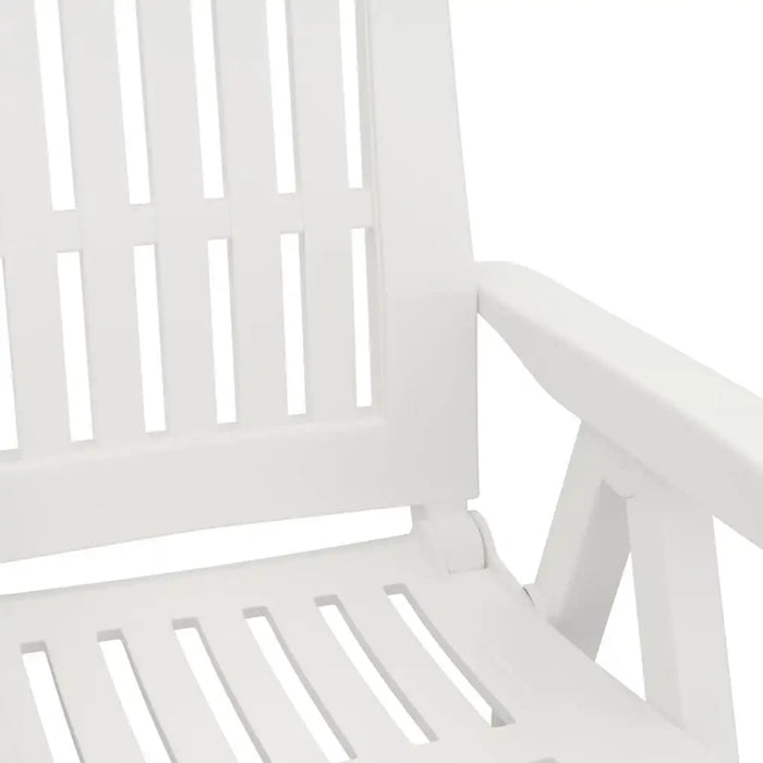 Close-up of a white garden reclining chair with slatted seat and armrest