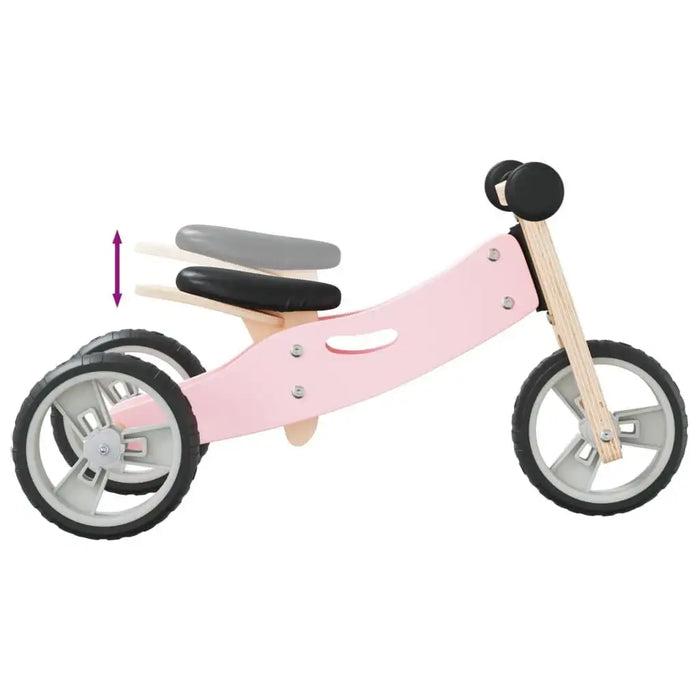 Pink and black 2-in-1 convertible balance bike with adjustable seat and handlebar, side view