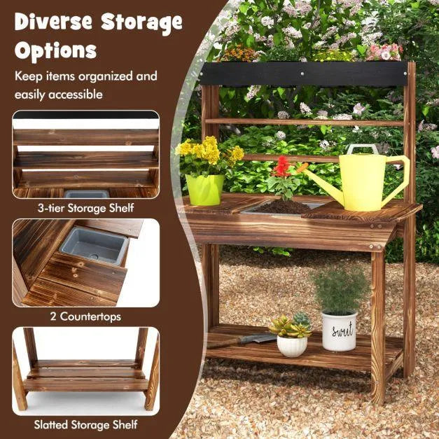 Wooden outdoor mud kitchen with double countertops, shelves, and gardening tools in a garden
