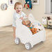 Baby pushing elephant-shaped 2-in-1 walker and shopping cart filled with stuffed animals