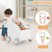 Toddler using elephant-shaped baby walker filled with plush toys, ergonomic design shown