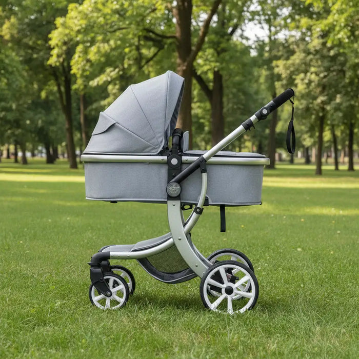 Gray baby stroller on grass with trees in the background