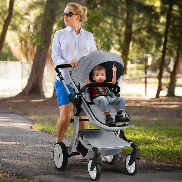 Woman pushing a stroller with a child in a park