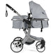 Gray baby stroller with canopy on a white background