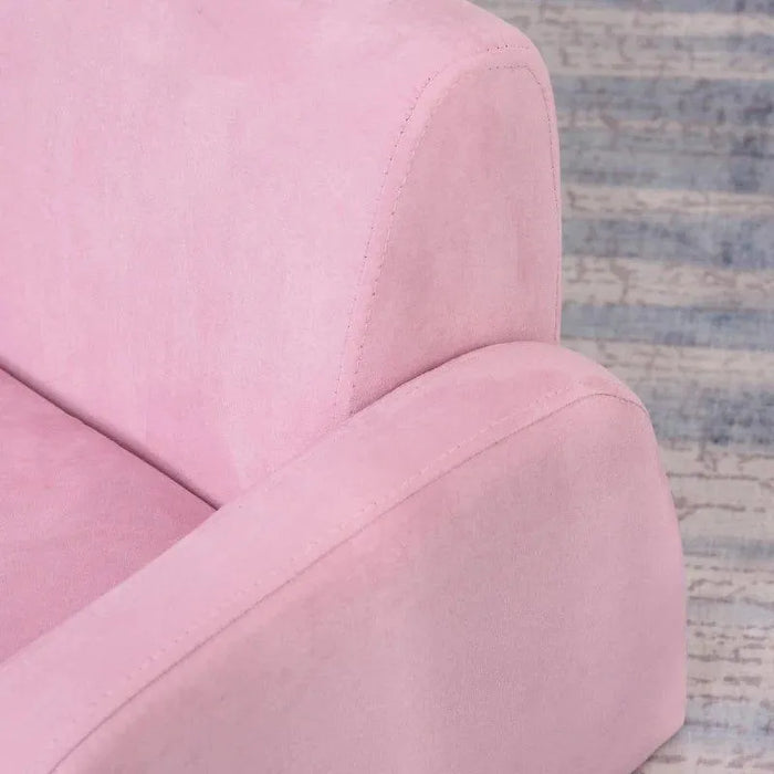 Close-up of pink kids convertible armchair on patterned rug