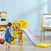Toddler playing near yellow lion-themed slide with basketball hoop in playroom