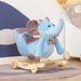 Blue plush elephant 2-in-1 rocking horse convertible rocker with wheels in nursery room
