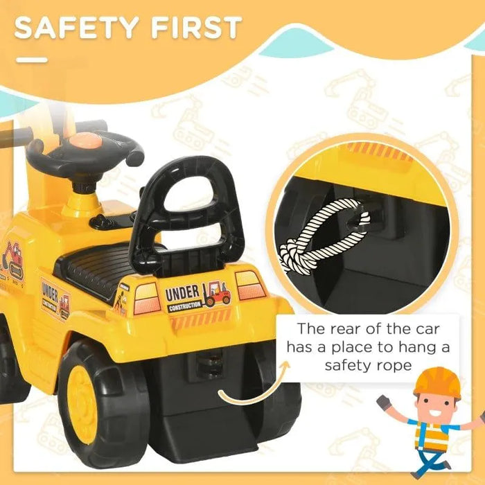 Yellow toddler ride-on tractor digger with safety rope attachment, labeled 'Under Construction'.