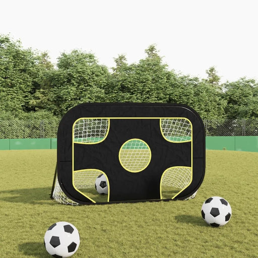 2-in-1 football goal net with black and yellow frame on grass field, three soccer balls