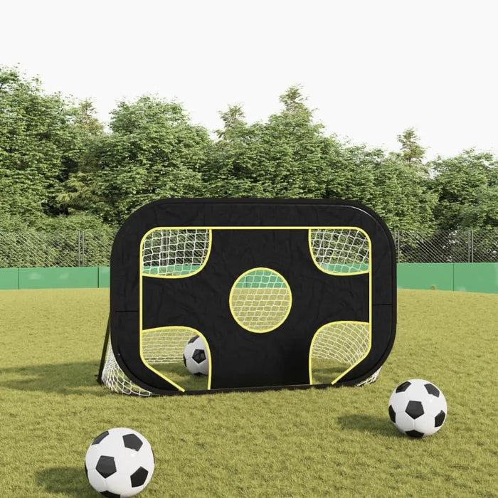 2-in-1 football goal net with black and yellow frame on grass field, three soccer balls