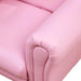 Close-up of a pink kids armchair with soft upholstery and rounded armrest