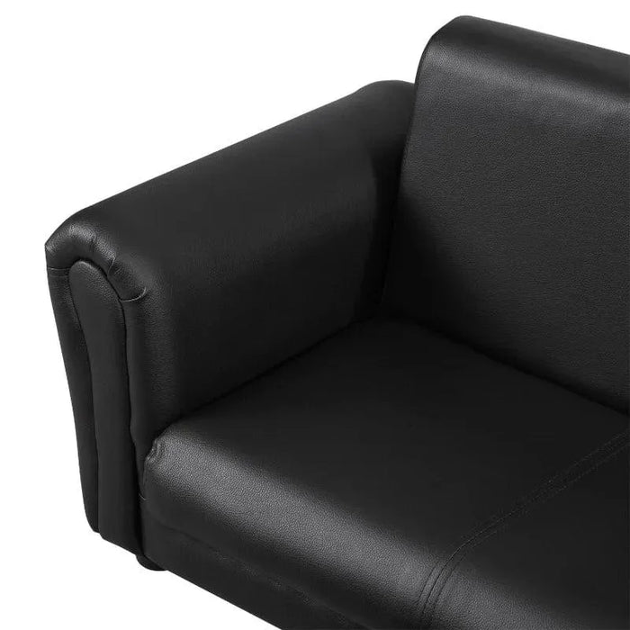 Close-up of black two-seater kids sofa armrest and seat, faux leather upholstery