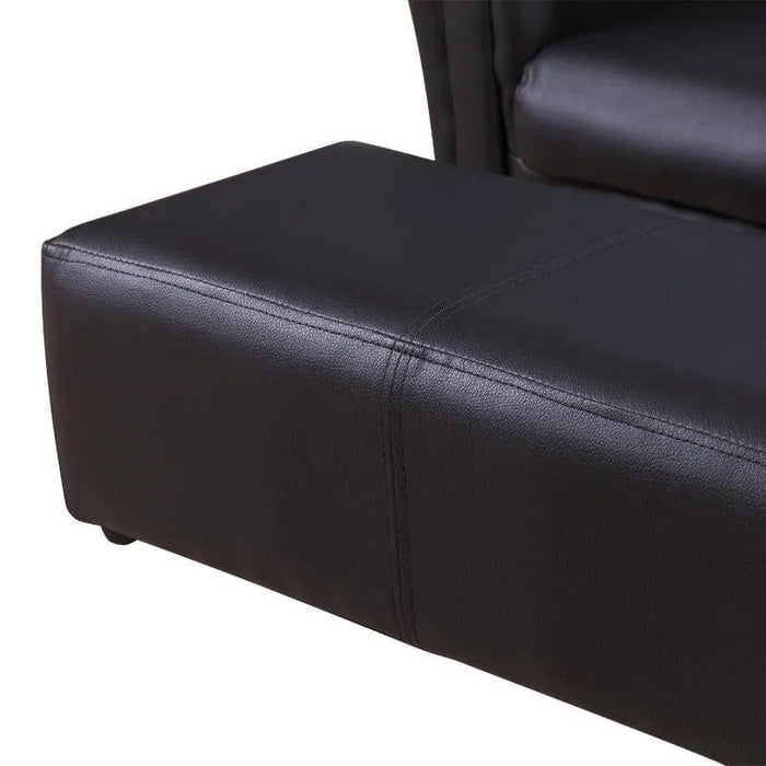 Black faux leather kids sofa set with matching footstool, close-up view