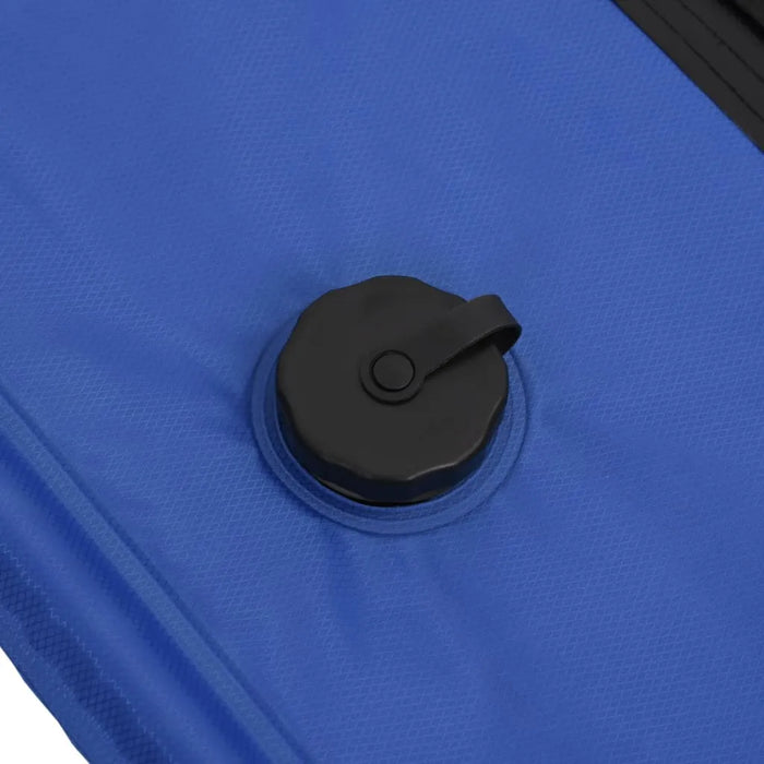 Close-up of blue portable solar camping shower bag with black screw cap