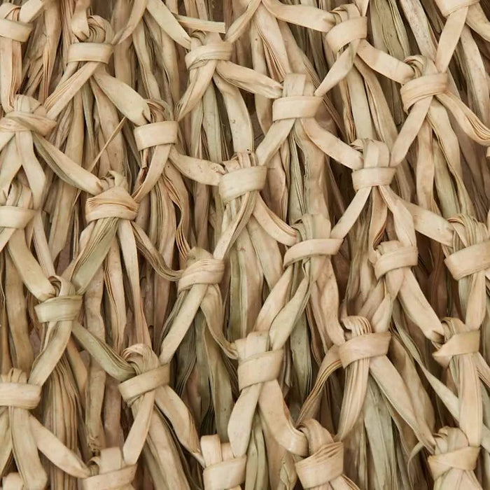 Hand-woven natural bamboo roof detail of tropical banana leaf garden parasol