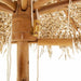 Close-up of bamboo pole and hand-woven roof on tropical banana leaf garden parasol