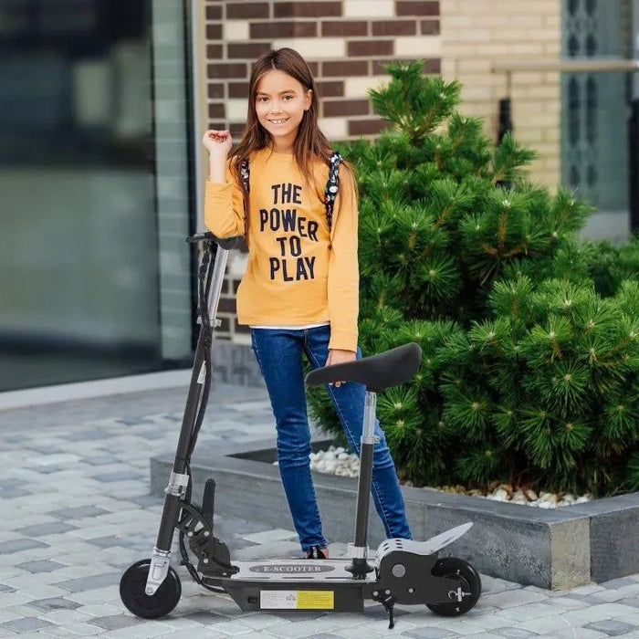 Girl with long hair standing outdoors next to a black foldable 24V electric scooter with adjustable seat