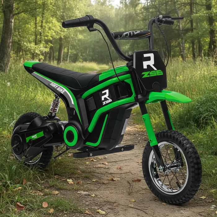 Green 24V kids electric dirt bike with black accents on a forest trail