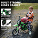Child on green 24V kids electric dirt bike with helmet, foldable footrests, outdoor setting